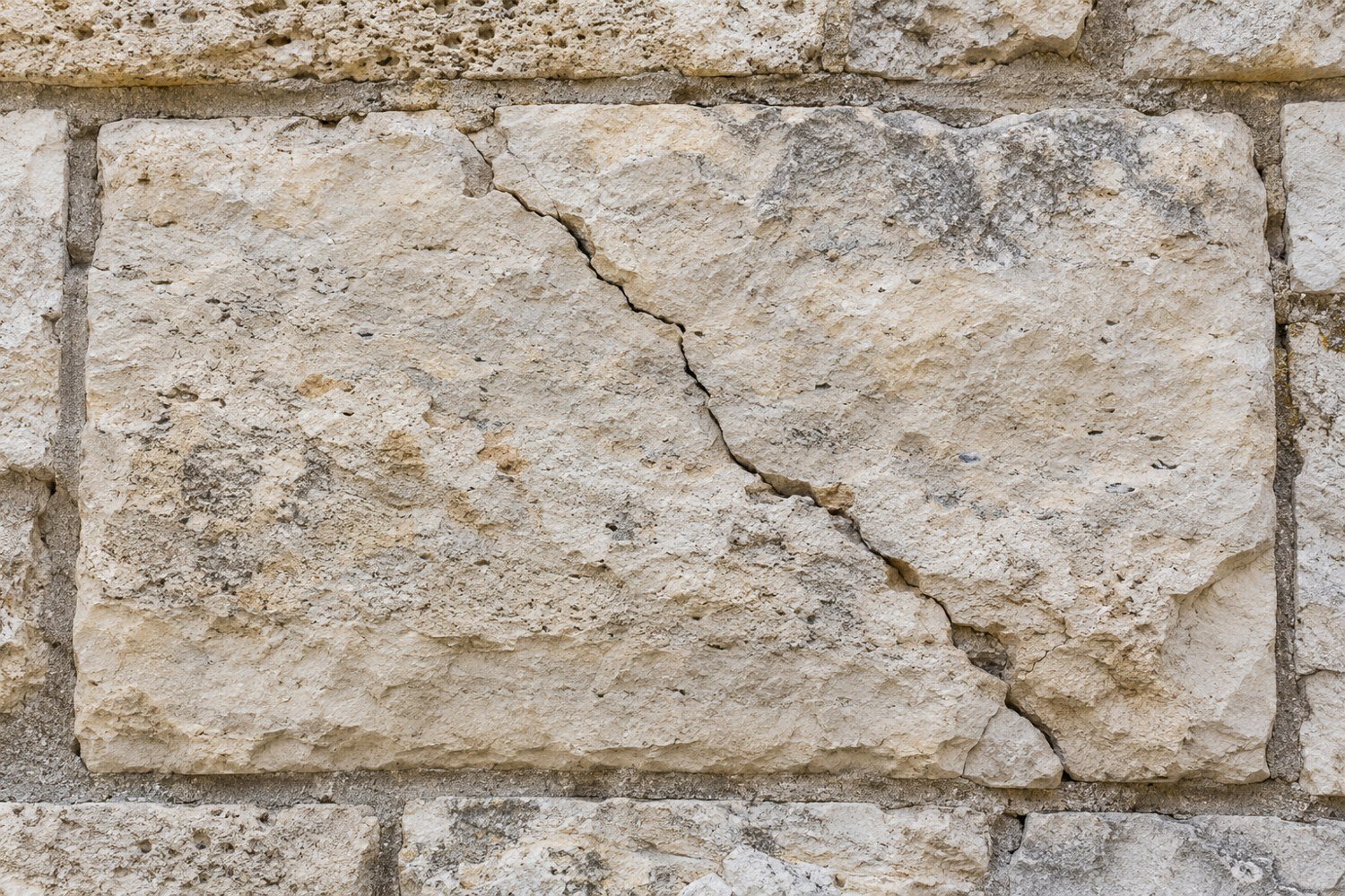 Illustrative cracked stone · limestone surface