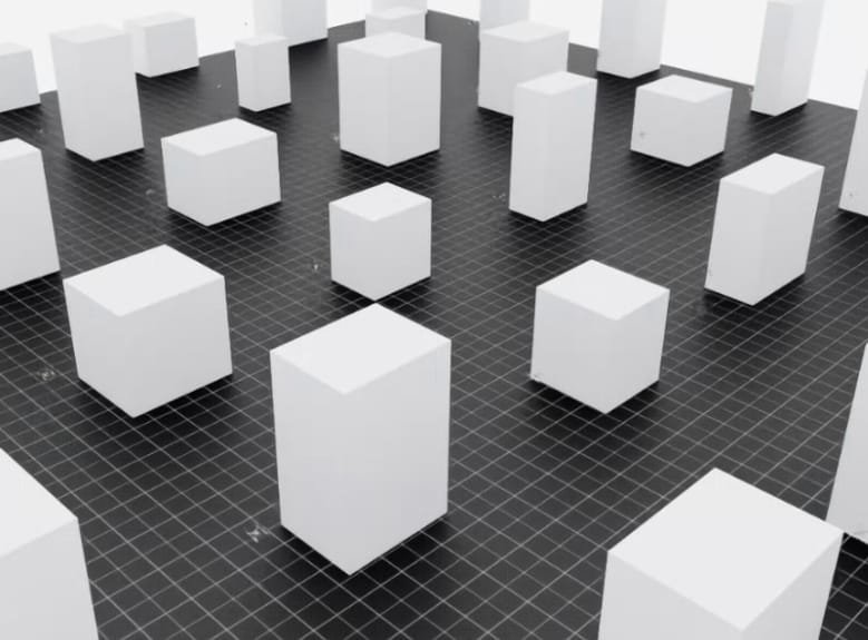 Simulated city of white building blocks on a dark grid